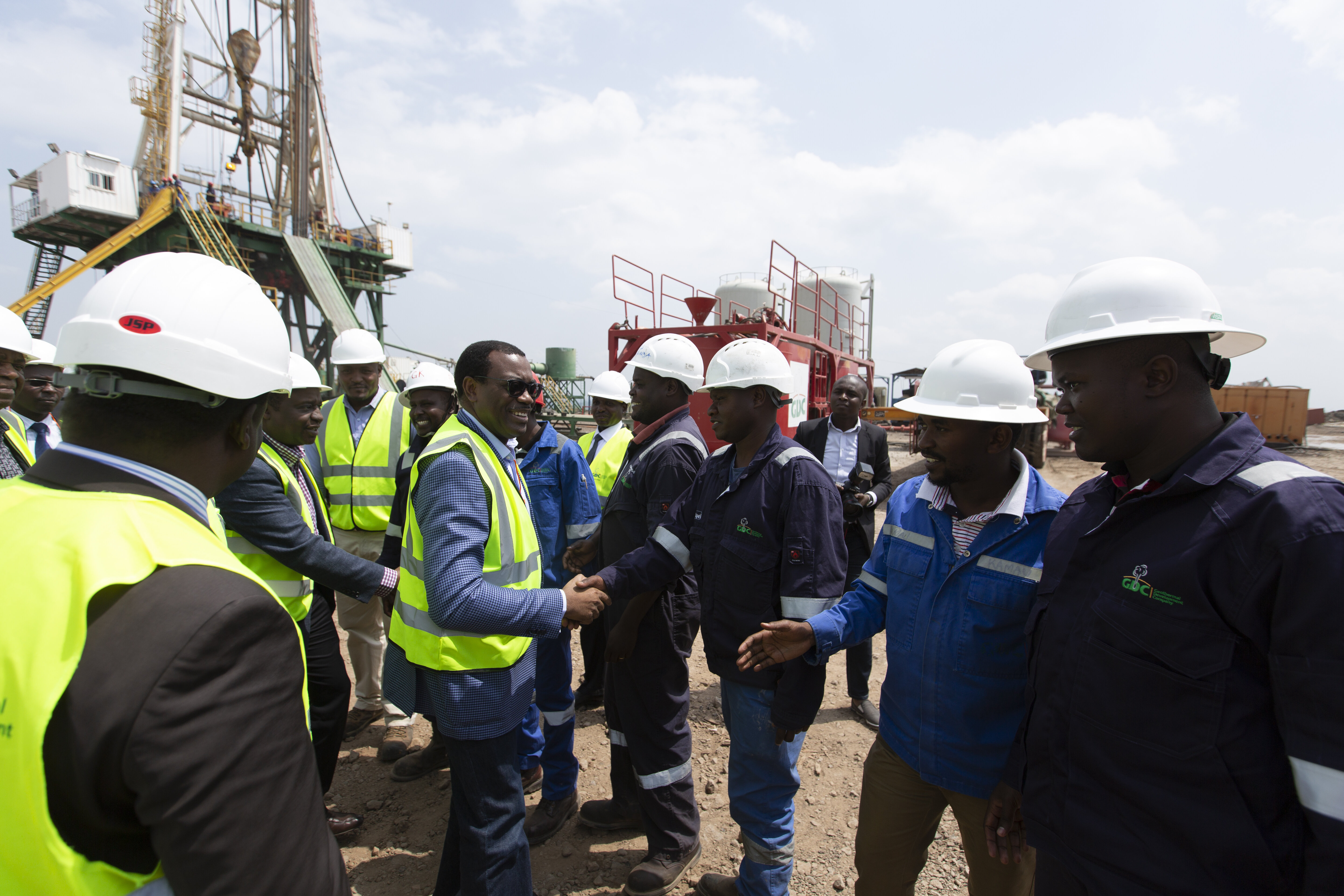 Dr. Adesina on a site visit with hardhats