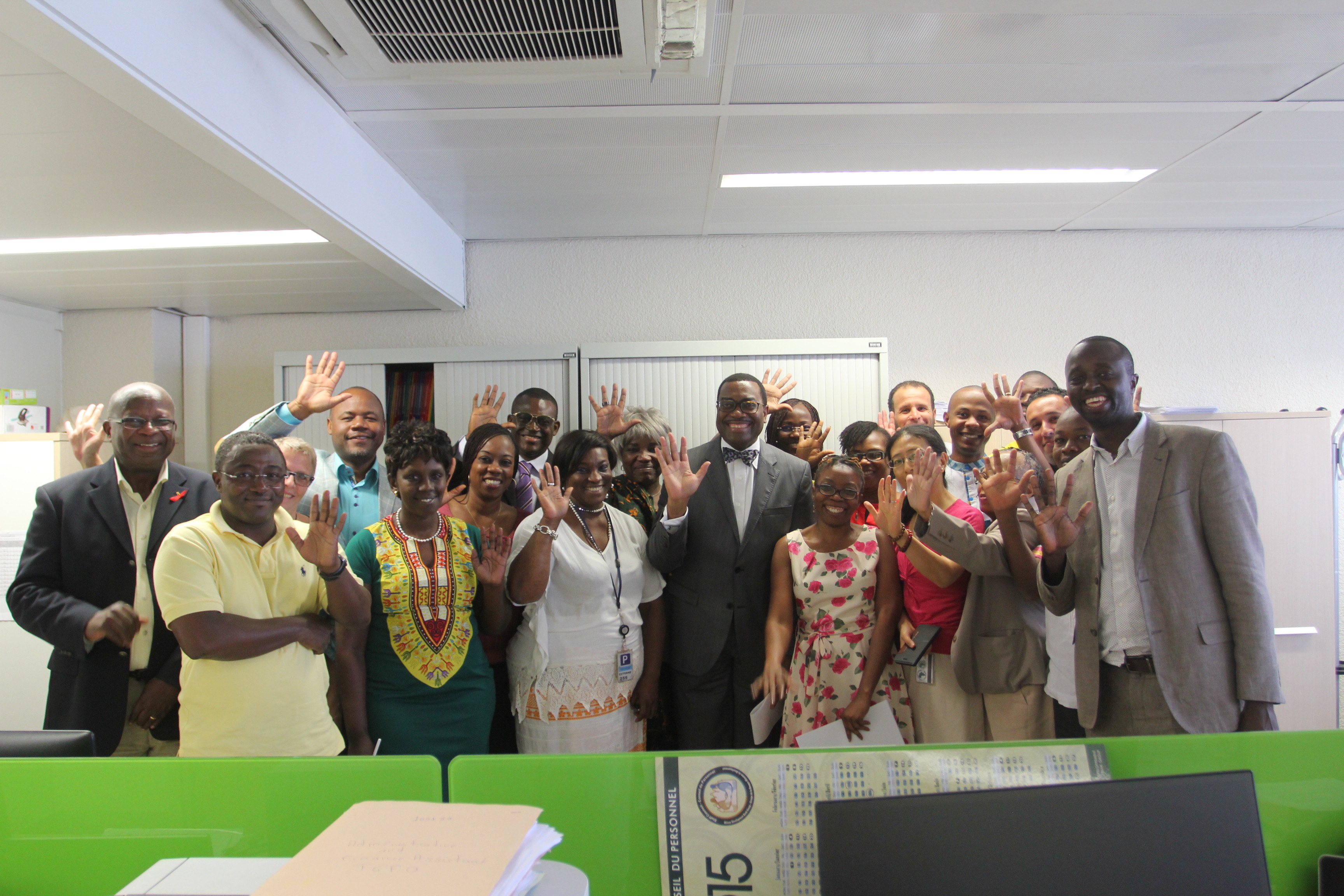 Dr. Adesina with his office team